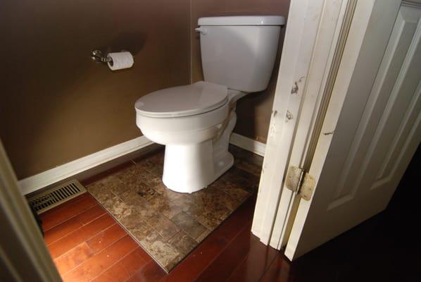 Small flooring repair to correct for a toilet that nearly fell through the floor.