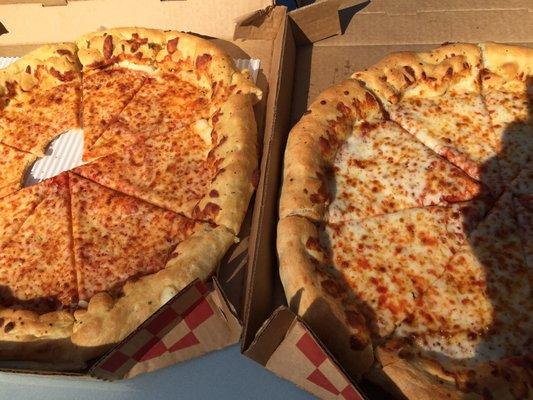 The remade pizza is on the right. You can still see the dough on the pizza on the left, with, "extra cheese."