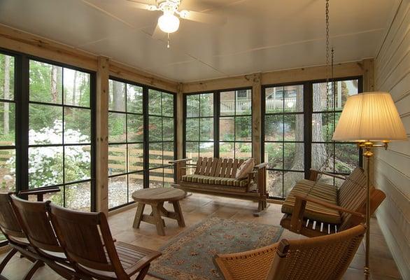 This home features a sunroom addition with floor to ceiling windows and a new Provia door!