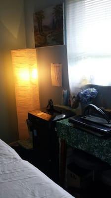 View of desk in room and light.