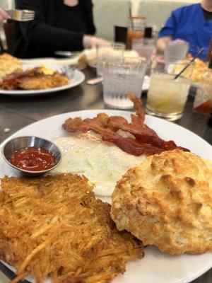 Hashbrown, over-easy egg, bacon   @phidingthefam