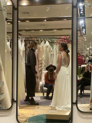 Photo of the fitting room mirror reflecting the rack where you can view the different styles.