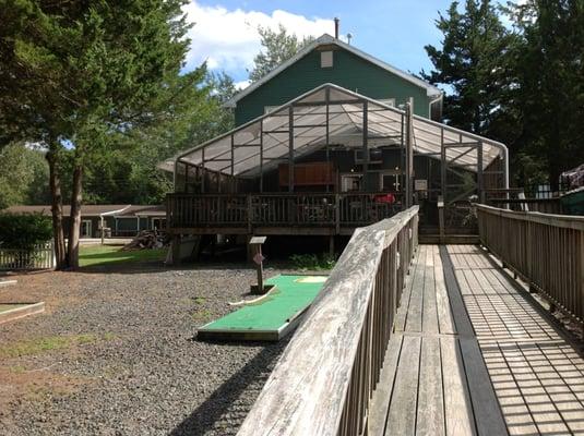 Screened in back deck for the Turtlerun Grill/Deli and activities.