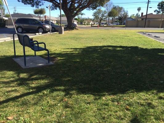 Lawn in front with shade and chair