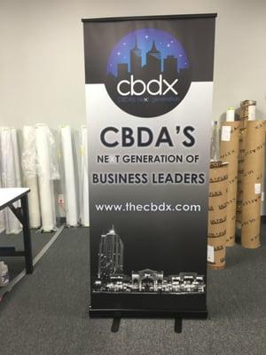 Check out this retractable banner we made for CBDX. Retractable banners can be used in the office, studio, store and more.