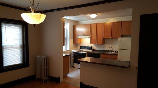 Updated Kitchen in Vintage apartment with breakfast bar.