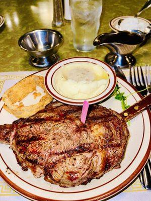 13 ounce ribeye steak medium rare with cowboy mashed potatoes