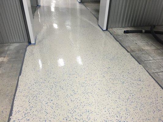 Epoxy coating aisle way in a commercial building.