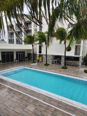 The restaurant overlooks the pool and the ocean is just past the pool.