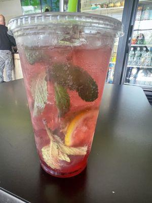 Strawberry and pomegranate mojito