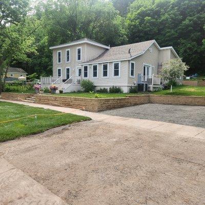 Retaing wall, graded drive way and new sod