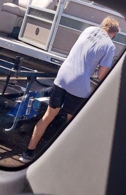 Employee cleaning a boat