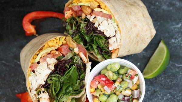 Chicken Cashew Avocado Wrap- grilled chicken, avocado, cashews, cheddar cheese, fresh basil, mixed greens & diced tomatoes with sriracha hot