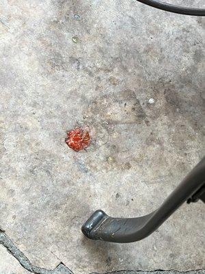 Smashed tomato and greasy stone flooring on the patio.