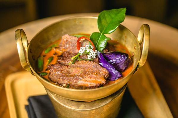 Sous vide 12 hours braised beef cheeks in Panang curry, green beans and jasmine rice