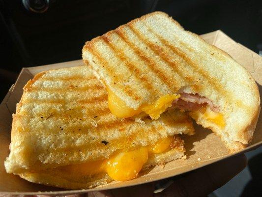 The grilled cheese is IMMACULATE! I added bacon to it. I believe they said it's made with 5 different cheeses.