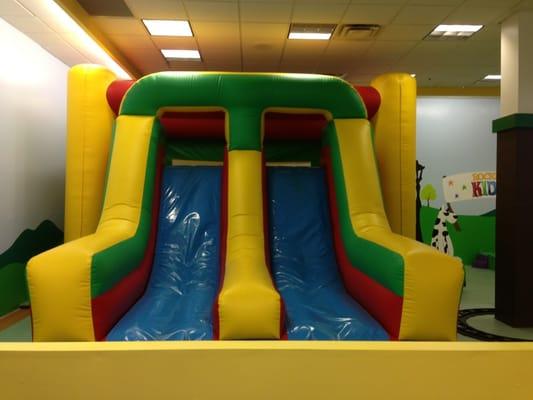 Front of bounce house has 2 slides