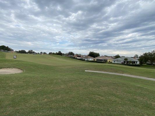 The hilly 9th fairway under some interesting cloud formations.