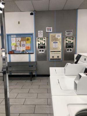 community board, bench, change machine and soap dispenser