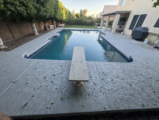 Remodeled pool with fresh acrylic lace decking, Tile, baja shelf and Tahoe Blue mini pebble