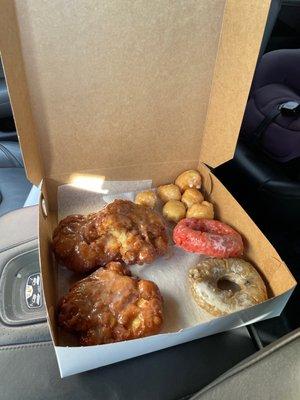 Apple fritters, blueberry and strawberry donuts, glazed holes