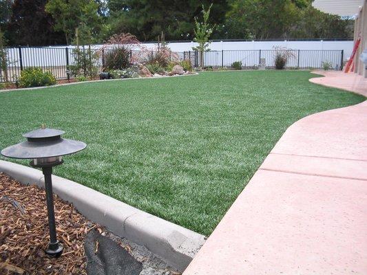 Backyard lawn area that extended play and lawn area by 1500 sq ft! (2004)