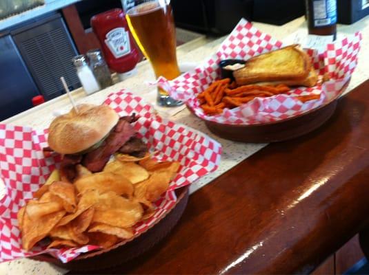 Georgia Big Dawg burger, medium rare w/kettle chips; pulled pork sandwich w/sweet potato fries.