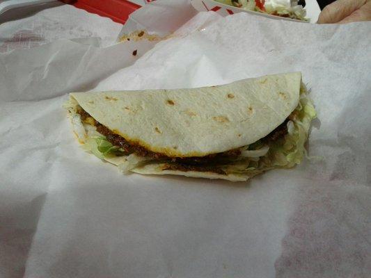 Soft taco filled with chicken, rice, beans, cheese. Yum...