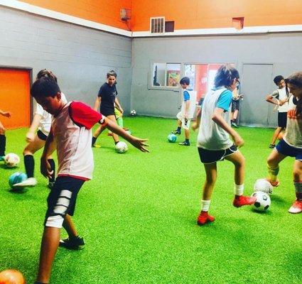 Soccer skills being learned at Avila Anderson Mill.