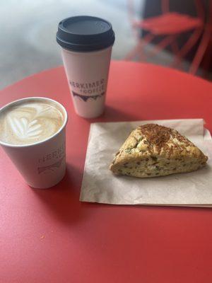 Oatmilk latte, drip coffee and dill scone.