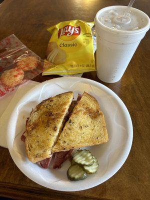 Reuben, cheese cookies, drink, chips.