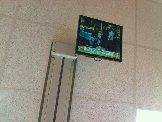 Flatscreen hanging from the ceiling