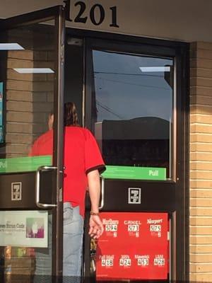 Yup!! She's been smoking while holding the door open as customers went in and out.