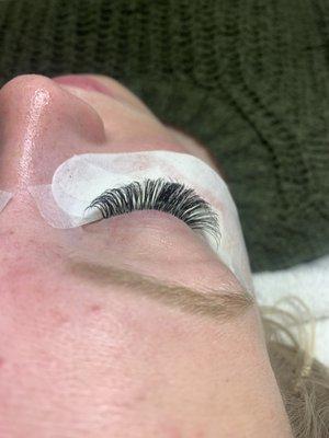 Client came in from another lash artist, lashes were glued on or placed correctly. This is the after.