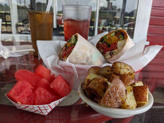 Grilled chicken wrap with mandarin orange, sesame, and ginger. Sided with home-fries and watermelon.