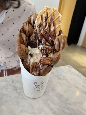 Chocolate puffle with added pecans, sweetened condensed milk, and wafer cookie