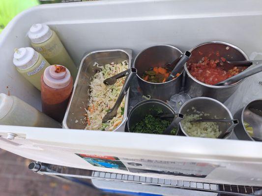 Salsa bar.   ALL fresh.  Guac sauce is yummy.