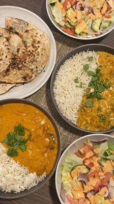 Butter chicken, side salads and garlic naan