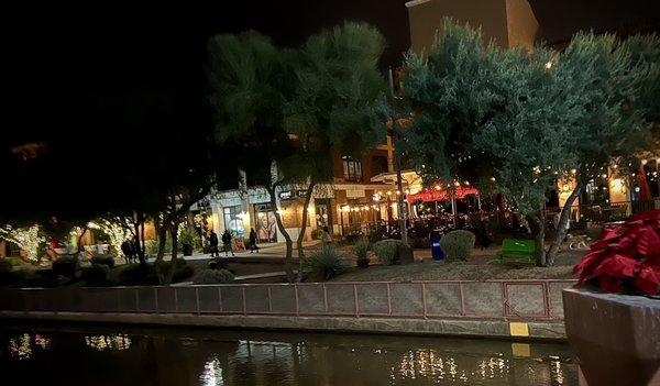 Partial view of charming night scene on Christmas Night! STK Steakhouse exterior patio by the water.  Dec 25, 2021