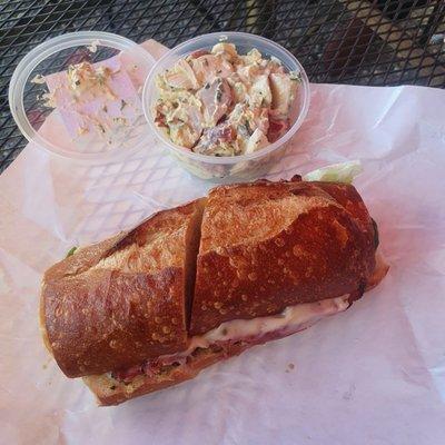 Potato salad and pastrami sandwich on Sourdough