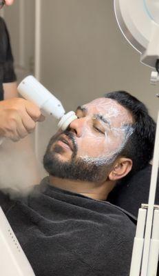 Facial treatment at Milton salon & barbershop