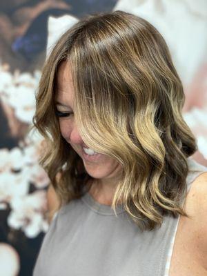 $188, 2.5 hours {included: Full coverage root touchup, Gloss, haircut, and blowdry with style}