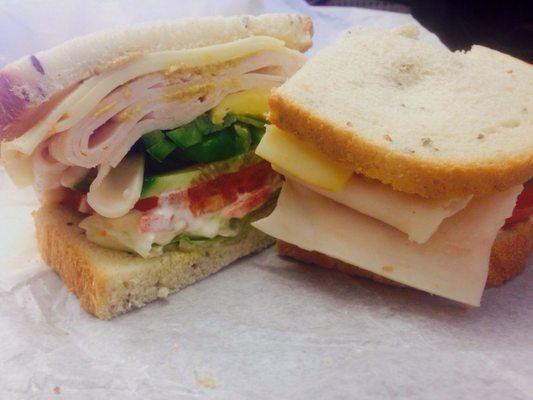 Turkey with avocado lettuce tomato on rye.