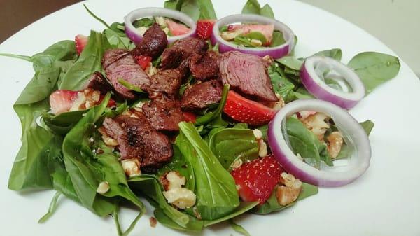 Grilled steak tips on our Spinach Salad