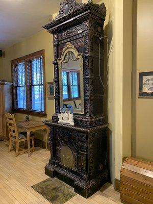 An antique Swiss chimney of the type the owners put in the lobby and each room of the Inn