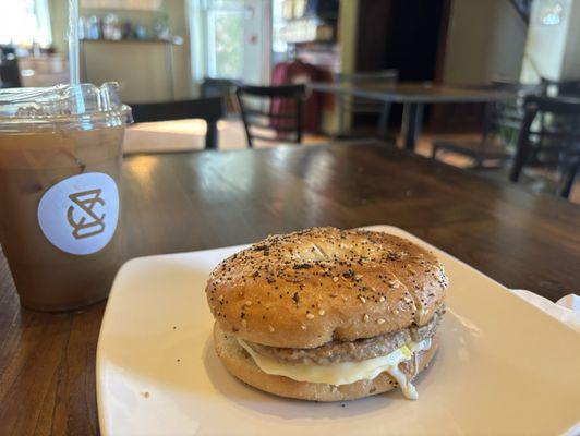 Breakfast sandwich with sriracha mayo. 16 oz cold brew with maple and almond milk.