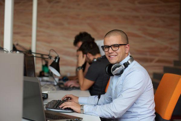 Smiling student in a modern office