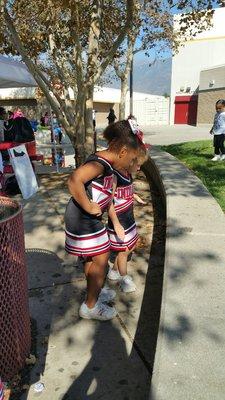 Little girls waiting to cheer