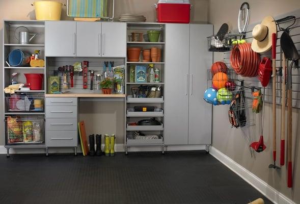 Metallic garage with workbench and slat wall organization