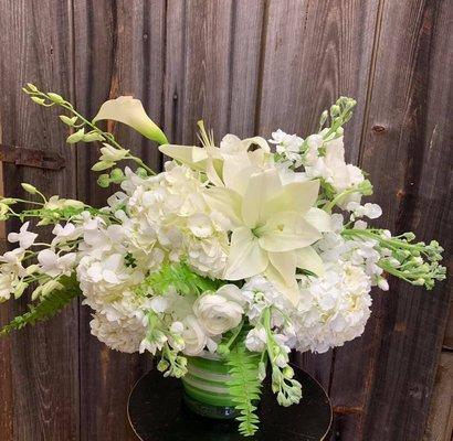 Beautiful group of white flowers including, lilies, orchids, hydrangeas, stock and other flowers